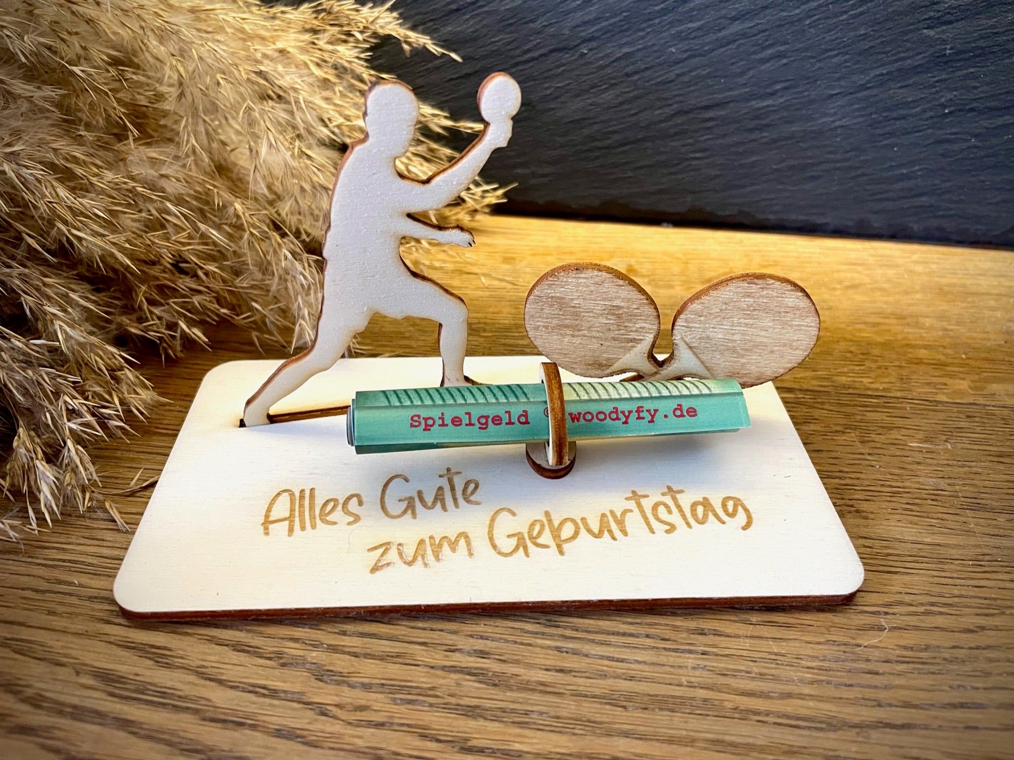 Geldscheinhalter Tischtennisspieler mit Tischtennisschläger