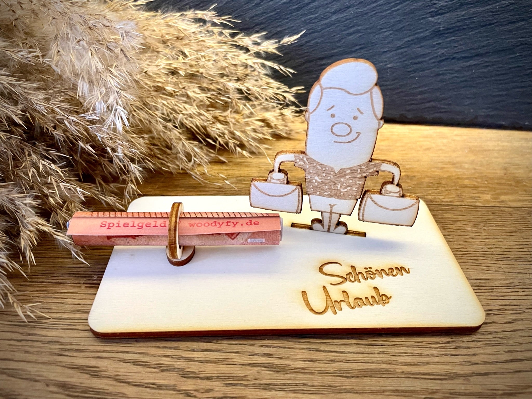 Geldscheinhalter Mann mit Koffer